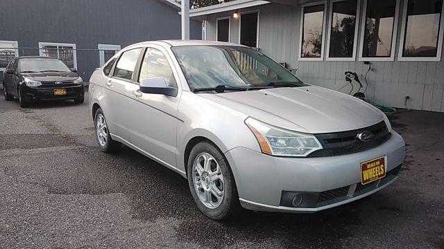 2009 Brilliant Silver Met Ford Focus SES Sedan (1FAHP36N89W) with an 2.0L L4 DOHC 16V engine, located at 1821 N Montana Ave., Helena, MT, 59601, 46.603447, -112.022781 - Photo #2