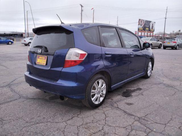 2009 Honda Fit Sport 5-Speed MT (JHMGE87409S) with an 1.5L L4 SOHC 16V engine, 5-Speed Manual transmission, located at 4047 Montana Ave., Billings, MT, 59101, 45.770847, -108.529800 - Photo #2