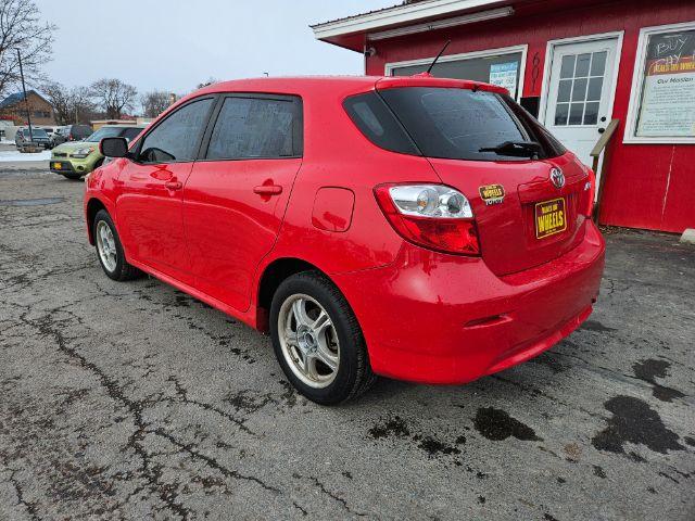 2009 Radiant Red Toyota Matrix Base 5-Speed MT (2T1KU40E09C) with an 1.8L L4 DOHC 16V engine, 5-Speed Manual transmission, located at 601 E. Idaho St., Kalispell, MT, 59901, 48.203983, -114.308662 - Photo #2