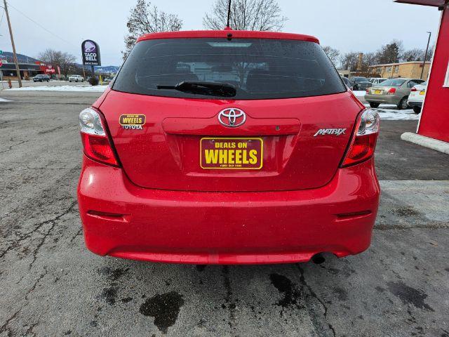 2009 Radiant Red Toyota Matrix Base 5-Speed MT (2T1KU40E09C) with an 1.8L L4 DOHC 16V engine, 5-Speed Manual transmission, located at 601 E. Idaho St., Kalispell, MT, 59901, 48.203983, -114.308662 - Photo #3