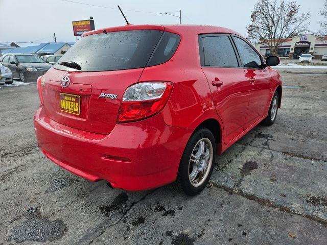 2009 Radiant Red Toyota Matrix Base 5-Speed MT (2T1KU40E09C) with an 1.8L L4 DOHC 16V engine, 5-Speed Manual transmission, located at 601 E. Idaho St., Kalispell, MT, 59901, 0.000000, 0.000000 - Photo #4