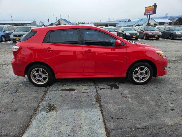 2009 Radiant Red Toyota Matrix Base 5-Speed MT (2T1KU40E09C) with an 1.8L L4 DOHC 16V engine, 5-Speed Manual transmission, located at 601 E. Idaho St., Kalispell, MT, 59901, 48.203983, -114.308662 - Photo #5