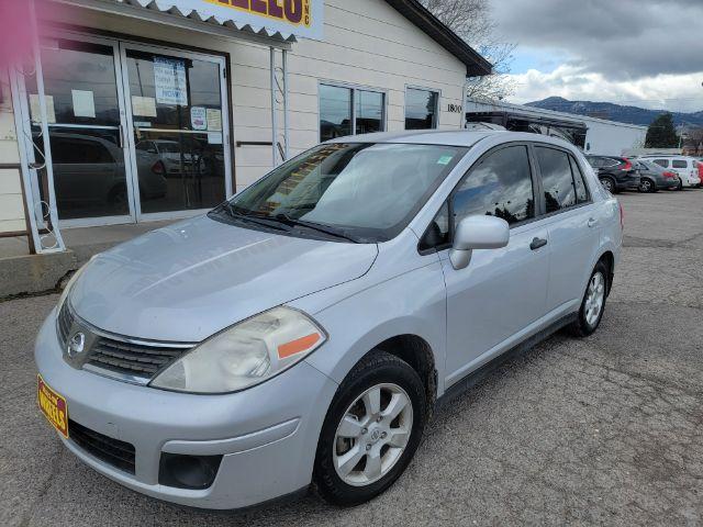 2009 Nissan Versa 1.8 S Sedan (3N1BC11E69L) with an 1.8L L4 DOHC 16V engine, located at 1800 West Broadway, Missoula, 59808, (406) 543-1986, 46.881348, -114.023628 - Photo #1