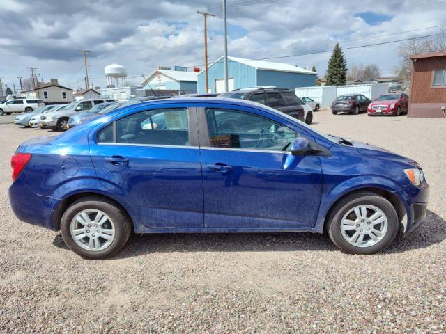 2014 Chevrolet Sonic LT Auto Sedan (1G1JC5SH6E4) with an 1.8L L4 DOHC 24V engine, 6-Speed Automatic transmission, located at 4801 10th Ave S,, Great Falls, MT, 59405, 47.494347, -111.229942 - Photo #5