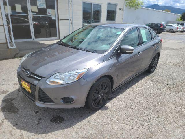 2014 Sterling Gray Metall Ford Focus SE Sedan (1FADP3F23EL) with an 2.0L L4 DOHC 16V engine, located at 1800 West Broadway, Missoula, 59808, (406) 543-1986, 46.881348, -114.023628 - Photo #0