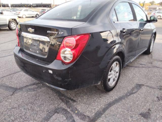 2014 Chevrolet Sonic LT Auto Sedan (1G1JC5SH7E4) with an 1.8L L4 DOHC 24V engine, 6-Speed Automatic transmission, located at 4047 Montana Ave., Billings, MT, 59101, 45.770847, -108.529800 - Photo #4