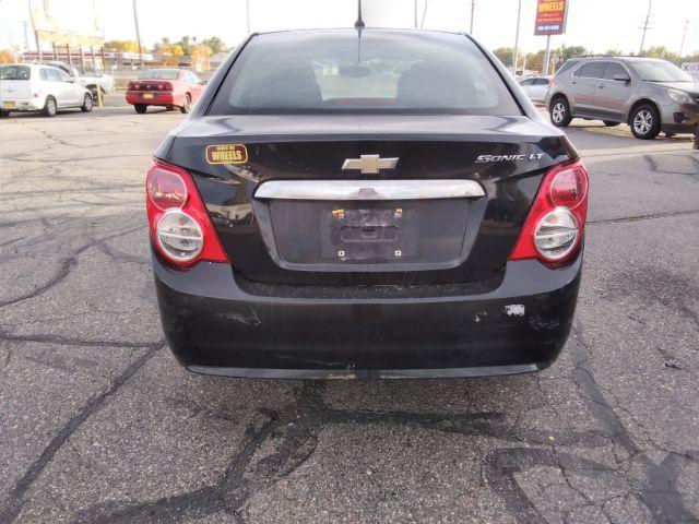 2014 Chevrolet Sonic LT Auto Sedan (1G1JC5SH7E4) with an 1.8L L4 DOHC 24V engine, 6-Speed Automatic transmission, located at 4047 Montana Ave., Billings, MT, 59101, 45.770847, -108.529800 - Photo #5