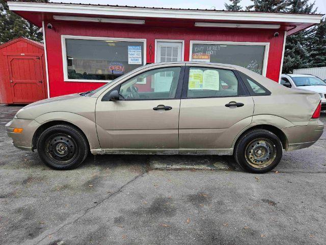 2005 Arizona Beige Metall Ford Focus ZX4 SE (1FAFP34N75W) with an 2.0L L4 DOHC 16V engine, located at 601 E. Idaho St., Kalispell, MT, 59901, 48.203983, -114.308662 - Photo #1