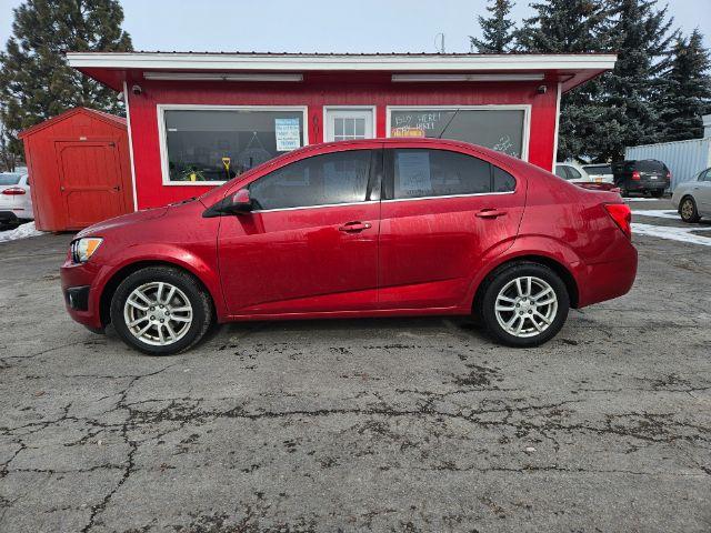 2015 Chevrolet Sonic LT Auto Sedan (1G1JC5SH4F4) with an 1.8L L4 DOHC 24V engine, 6-Speed Automatic transmission, located at 601 E. Idaho St., Kalispell, MT, 59901, 0.000000, 0.000000 - Photo #1