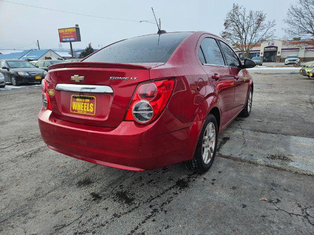 2015 Chevrolet Sonic LT Auto Sedan (1G1JC5SH4F4) with an 1.8L L4 DOHC 24V engine, 6-Speed Automatic transmission, located at 601 E. Idaho St., Kalispell, MT, 59901, 0.000000, 0.000000 - Photo #4