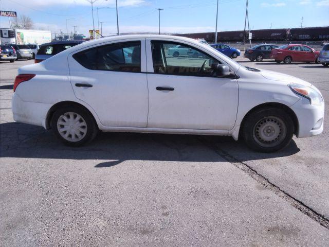 2015 Nissan Versa 1.6 S 5M (3N1CN7AP6FL) with an 1.6L L4 DOHC 16V engine, 5-Speed Manual transmission, located at 4047 Montana Ave., Billings, MT, 59101, 45.770847, -108.529800 - Photo #4