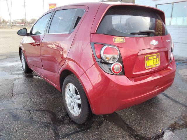 2013 Chevrolet Sonic LT Auto 5-Door (1G1JC6SB3D4) with an 1.4L L4 DOHC 24V TURBO engine, 6-Speed Automatic transmission, located at 4047 Montana Ave., Billings, MT, 59101, 45.770847, -108.529800 - Photo #6