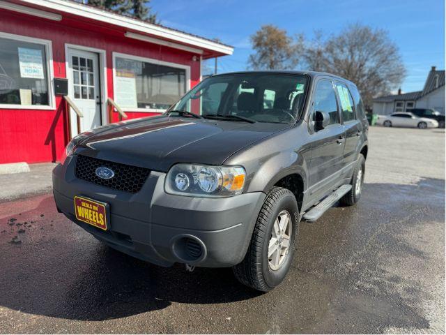 2007 Tungsten Grey Metallic Ford Escape XLS 4WD (1FMCU92Z87K) with an 2.3L L4 DOHC 16V engine, 4-Speed Automatic transmission, located at 601 E. Idaho St., Kalispell, MT, 59901, 48.203983, -114.308662 - Photo #0